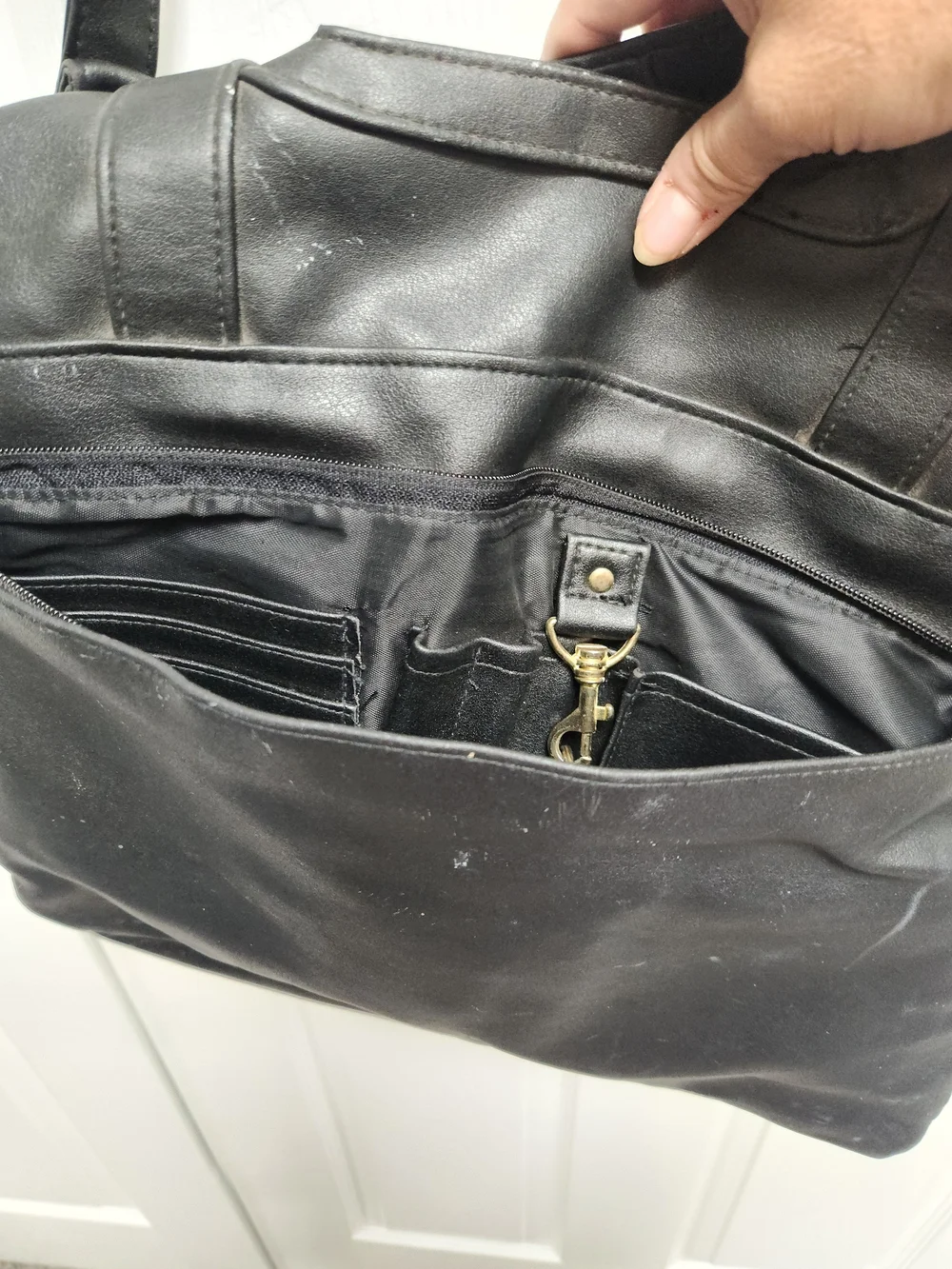 Black Leather Messenger Bag with Top Handle and Adjustable Shoulder Strap